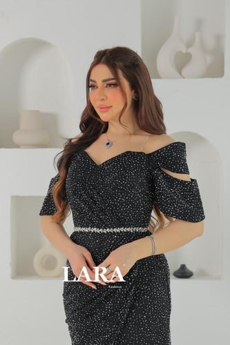 فستان سهرة مرصع بالفصوص اللماعة