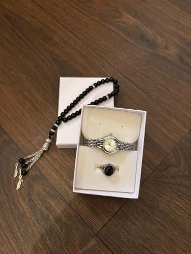 A watch with a prayer bead and a suitable ring from age one month to nine years