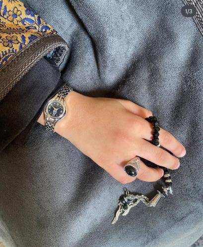 A watch, a prayer bead, and a ring (suitable from...