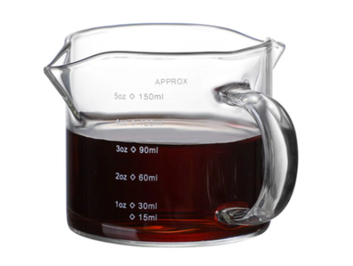 Graduated coffee mug with handle and two pouring s...