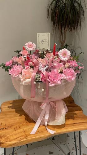 The story's bouquet of pink roses