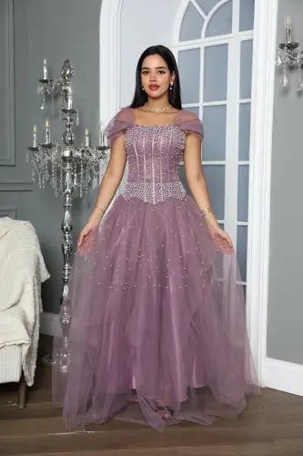 Evening dress, flesh-colored, with a beaded bodice and sequins