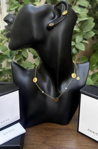 طقم قوتشي GG ذهبي (سلسال + حلق)