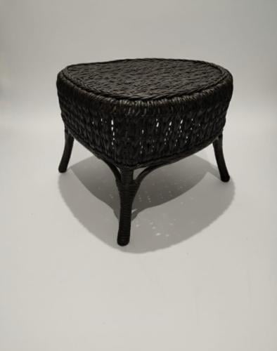Small round side wicker table with the glass
