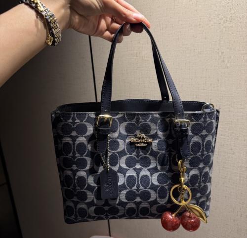 Coach Molly navy 25 with cherry medal