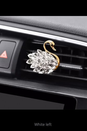 Car air freshener and decor on the left