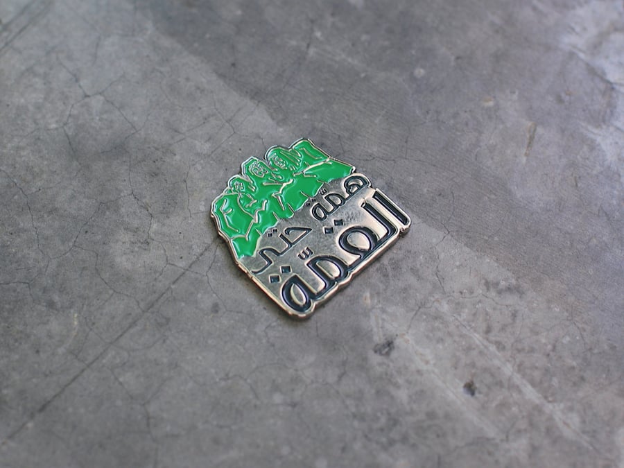 Mettle brooch up to the top
