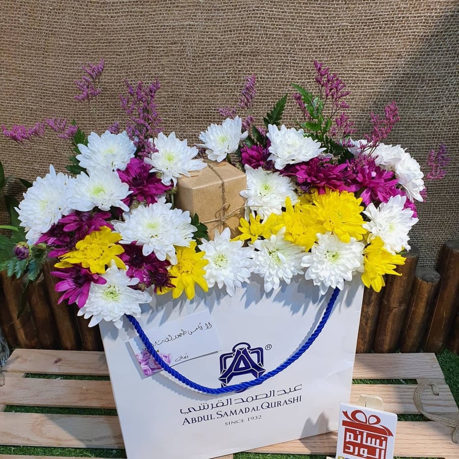 A bag with roses and gift wrapping