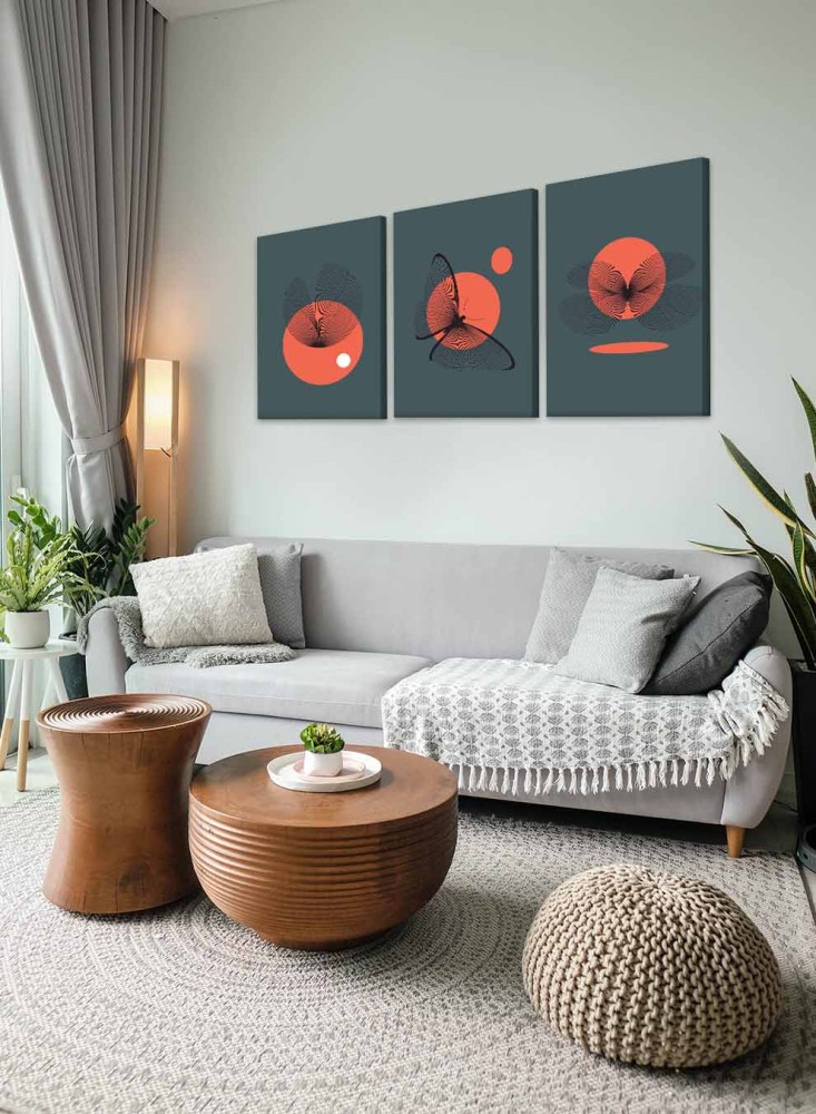 A set of 3 canvas panels on a wooden frame with a butterfly design and the sun