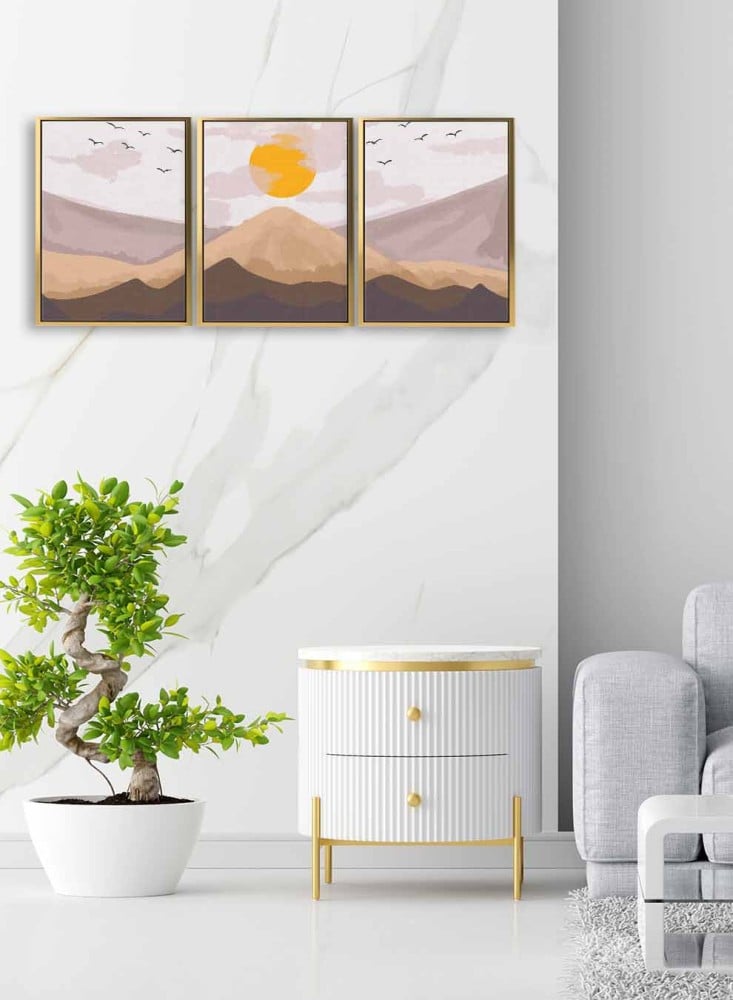 A set of 3 canvas panels on a wooden frame with an abstract art design of sunrise over the mountain