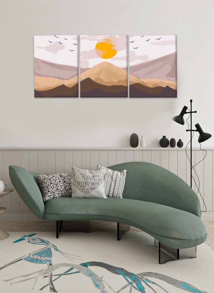 A set of 3 canvas panels on a wooden frame with an abstract art design of sunrise over the mountain