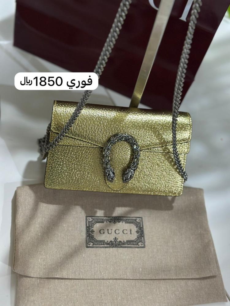 شنطة قوتشي ذهبي