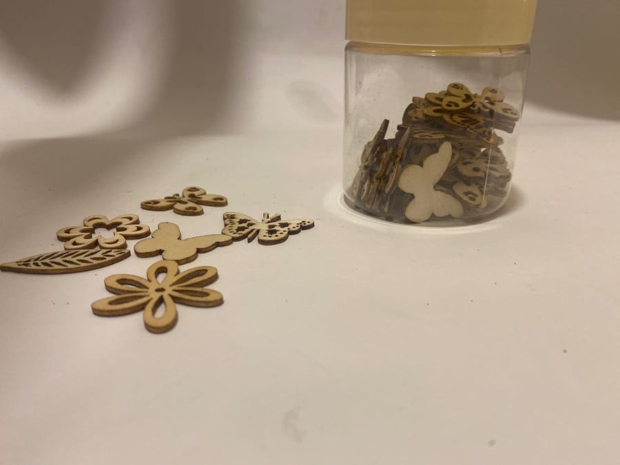 Wooden pieces arranged with roses and a pillow