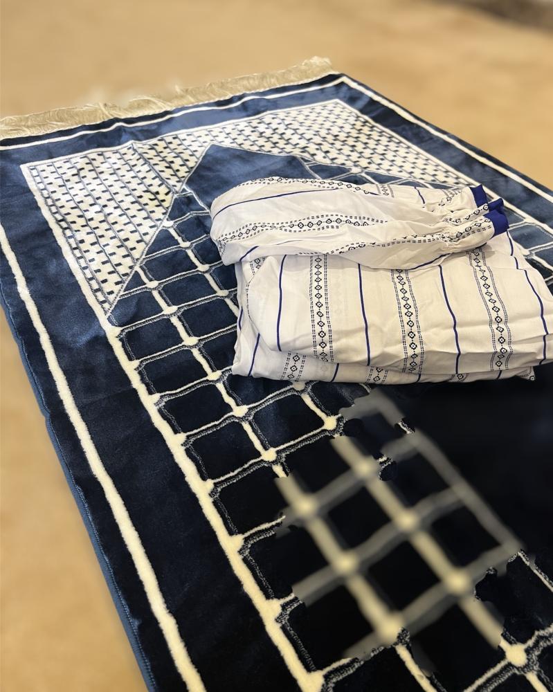 A prayer sheet gift in white and navy blue, and a navy blue carpet.