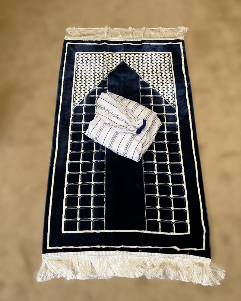 A prayer sheet gift in white and navy blue, and a navy blue carpet.