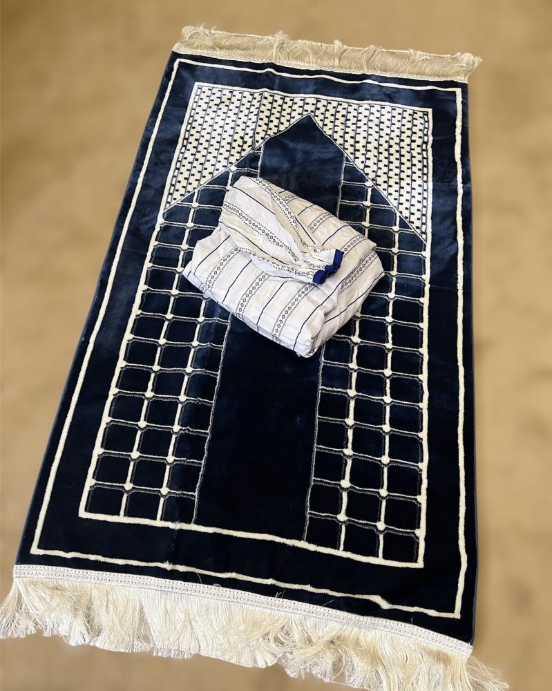 A prayer sheet gift in white and navy blue, and a navy blue carpet.