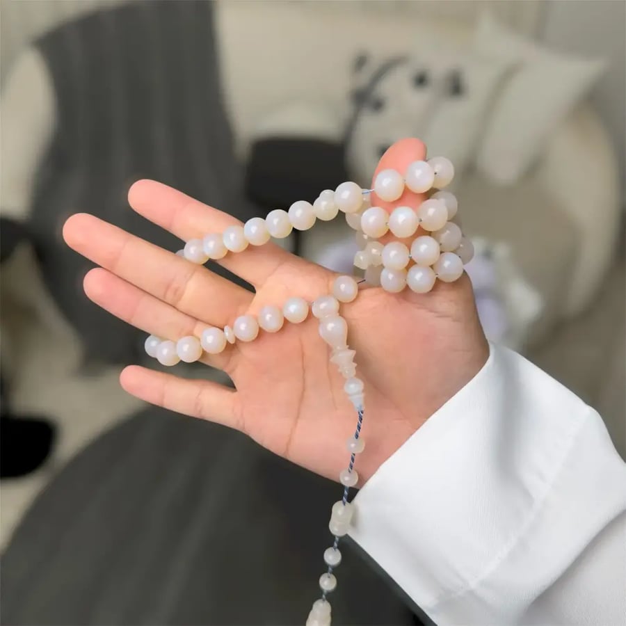 A prayer bead with a silver clasp - Mine