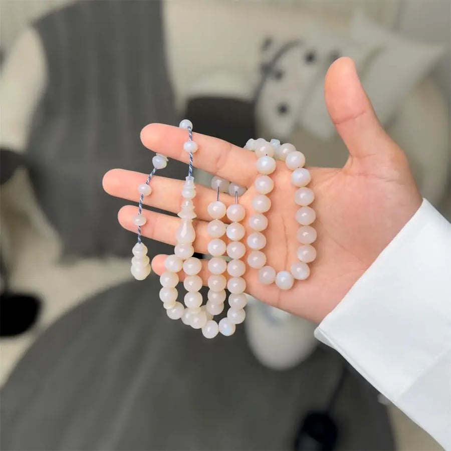 A prayer bead with a silver clasp - Mine