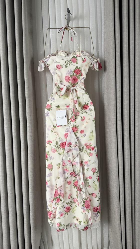 Soft off-white dress, soft floral pattern with pink flowers, with a ruffled collar and lace edges