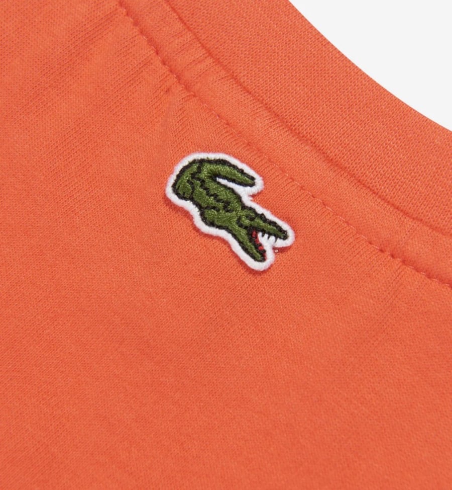 تيشرت  برتقالي مزين بشعار Lacoste