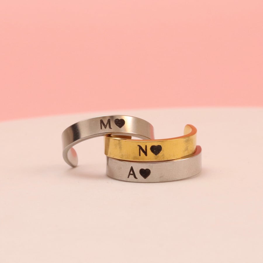 Letter-shaped plated ring