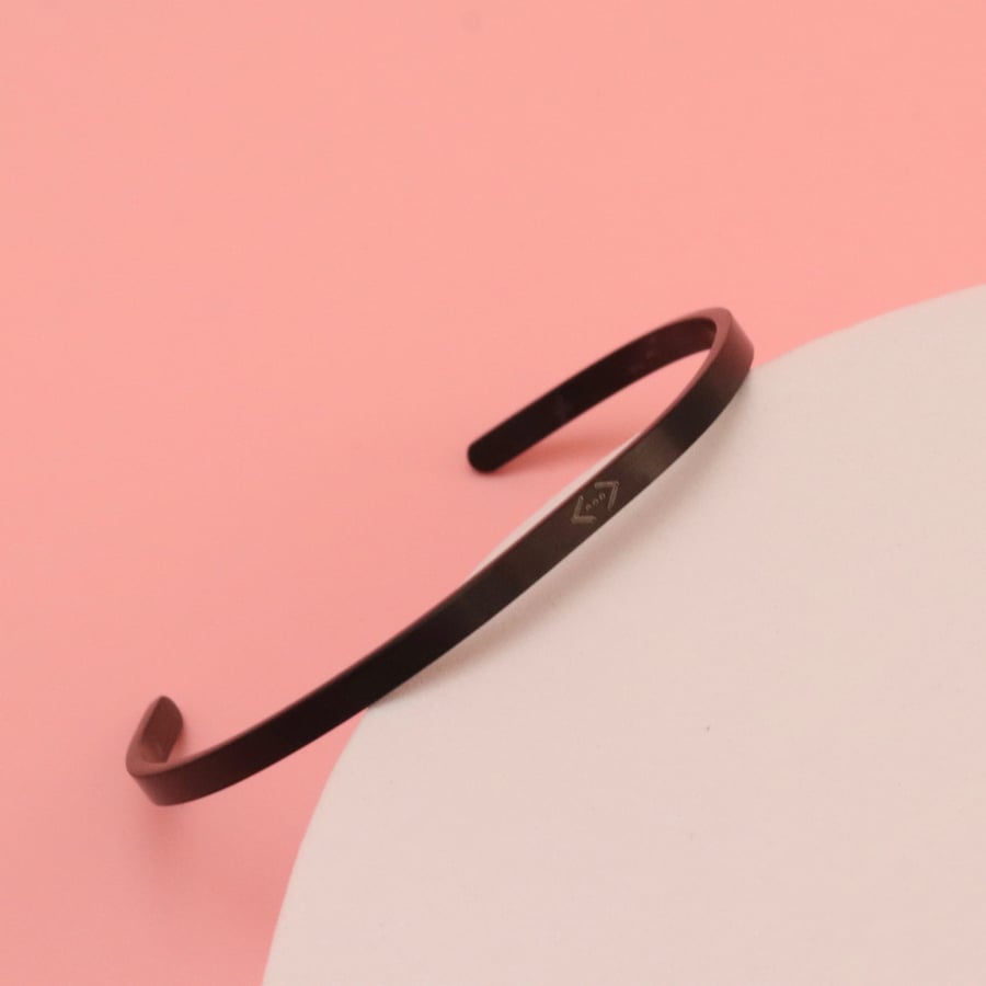 A bracelet plated with the crater logo