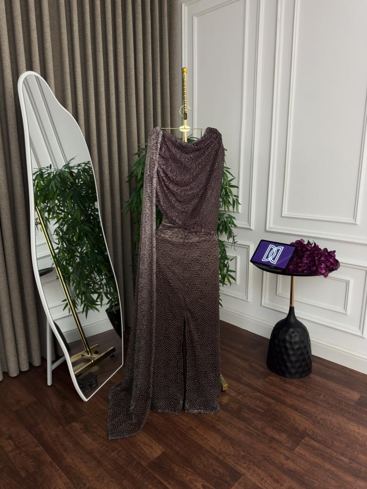 A brown wavy evening dress with a charming shine