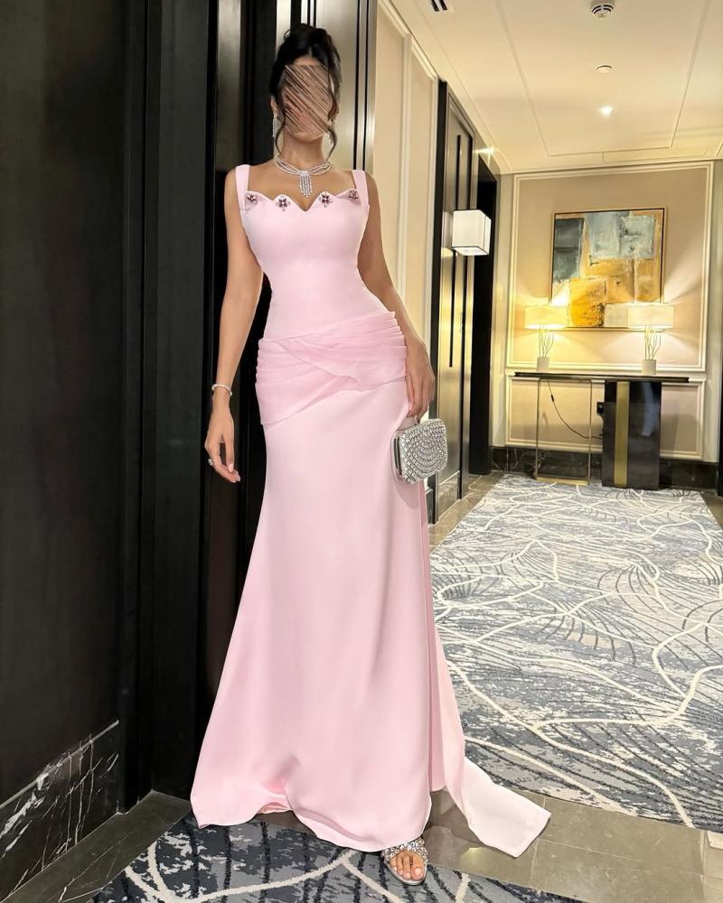 Long pink evening dress decorated with crystal with a back train