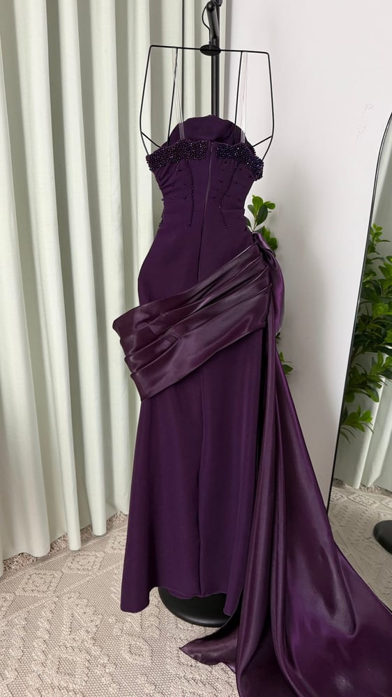 Lama's purple dress