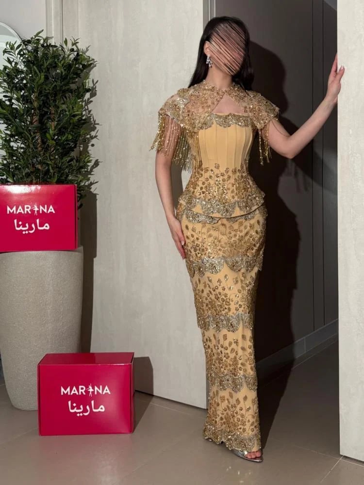 فستان دنيز  (فستان ذهبي   قطعتين صدريه كوسيه وكلفه شك راقي)