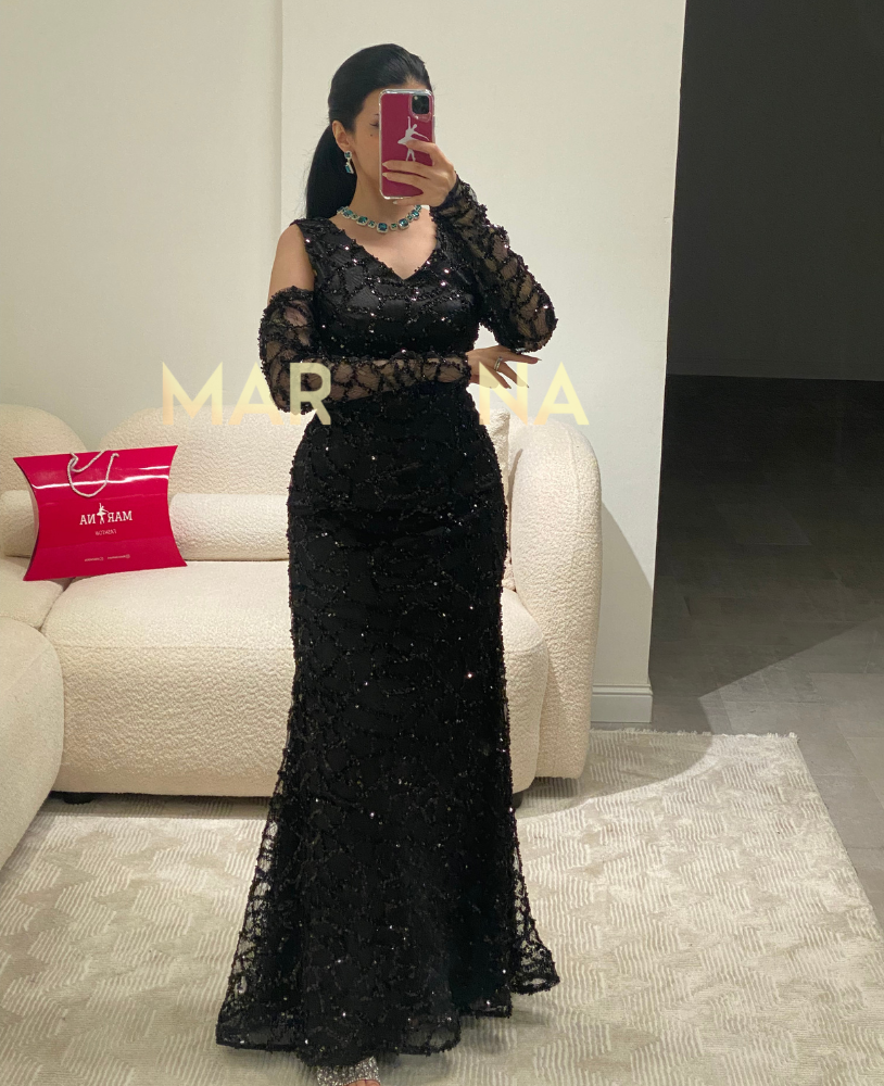 Latin dress (a black dress with embellishments, suitable for an elegant evening event)