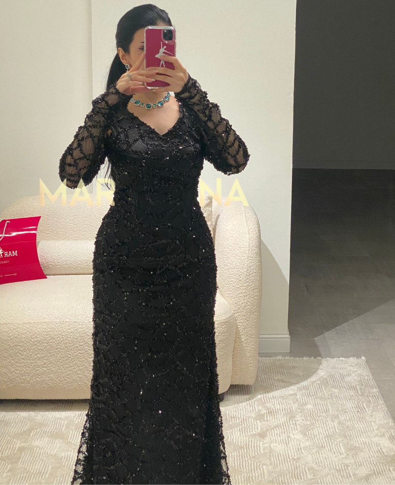 Latin dress (a black dress with embellishments, suitable for an elegant evening event)