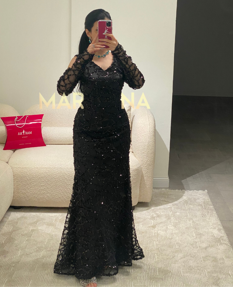 Latin dress (a black dress with embellishments, suitable for an elegant evening event)