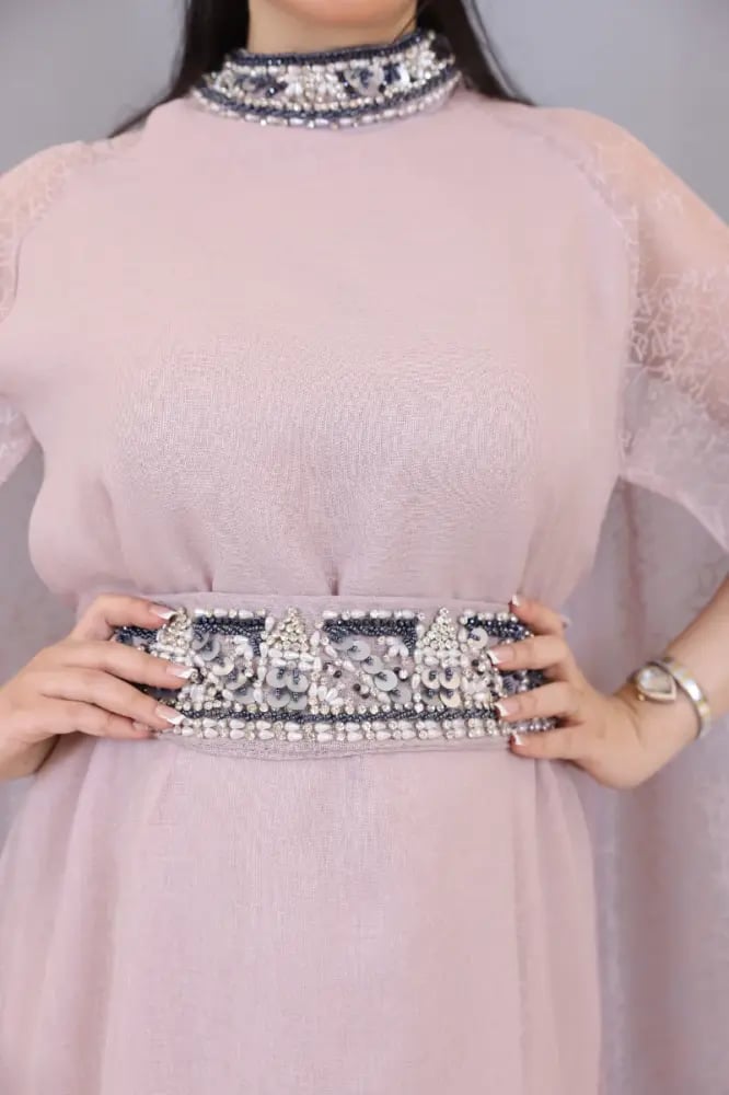 Linen dress decorated with luxurious hand embroidery on the collar and belt