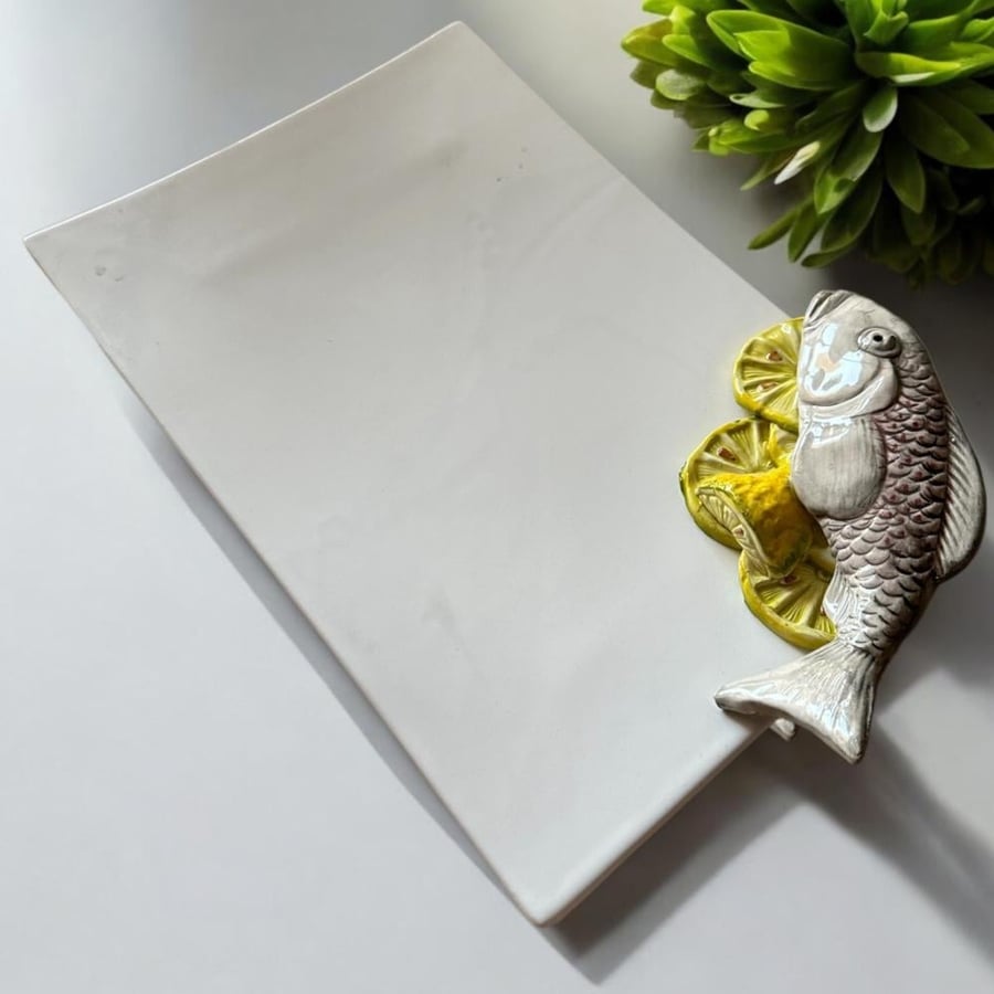 A dish with a fish-shaped sculpture