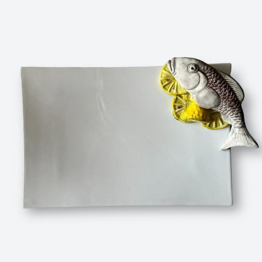 A dish with a fish-shaped sculpture