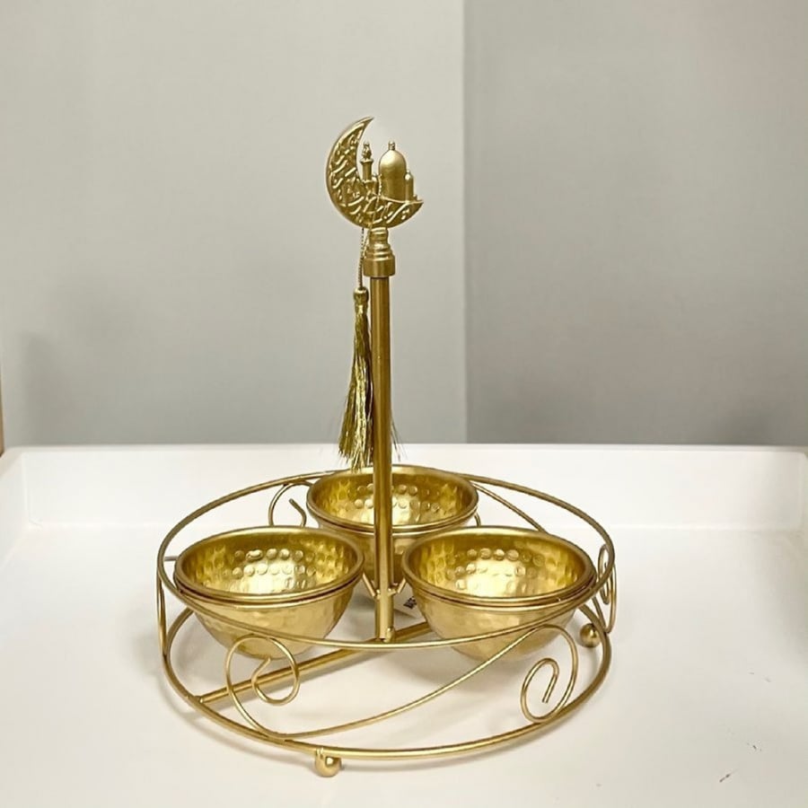 Golden date bar with three plates and an iron base