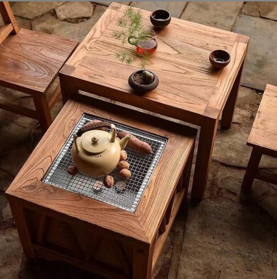 Wooden stove as an outdoor tea table