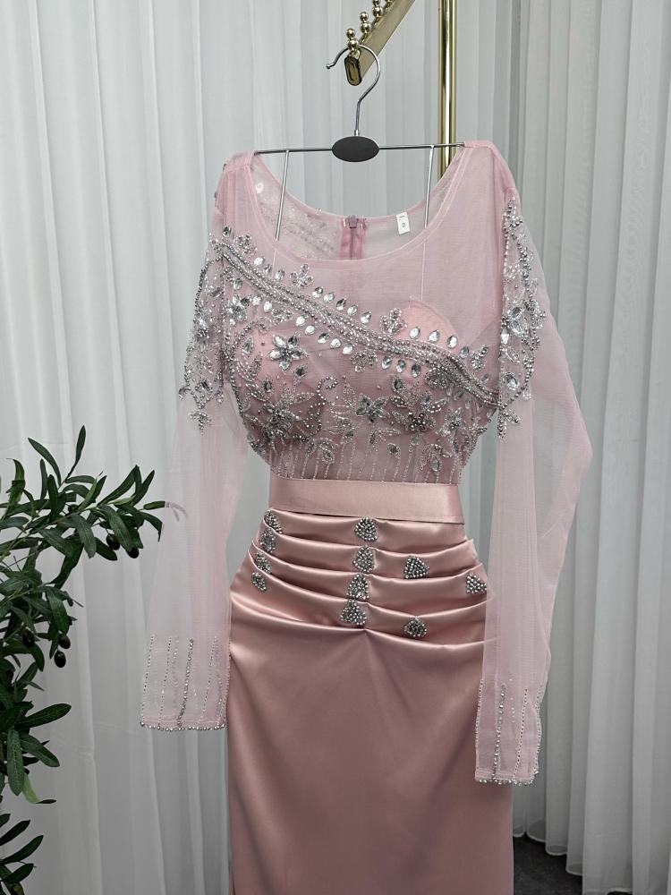 Angel dress. Elegant dress in nude color reflecting refined feminine softness and calm attractiveness, decorated with exquisite embroidery that adds a touch of distinguished luxury and fine details that highlight the beauty of the design. The fabric flows