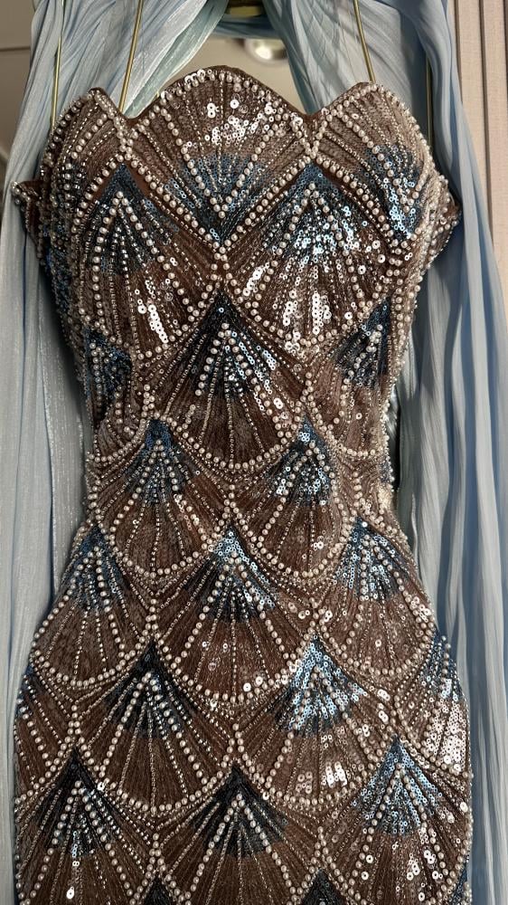 Friend. A luxurious beige champagne evening dress, fully embroidered with shiny details, a soft feminine cut that highlights the figure, with an elegant side slit.