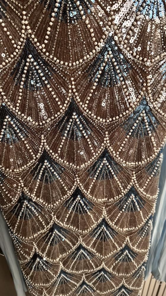 Friend. A luxurious beige champagne evening dress, fully embroidered with shiny details, a soft feminine cut that highlights the figure, with an elegant side slit.