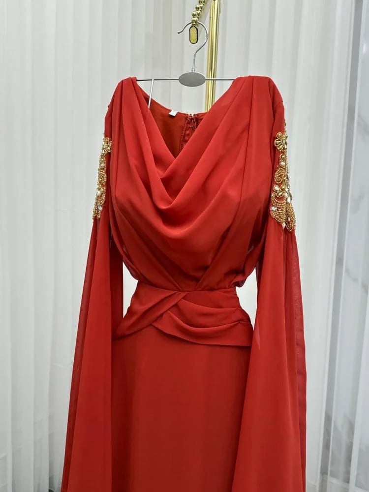 Ghada dress. Chiffon dress in warm taupe color reflecting calm elegance and natural attractiveness. It features lightweight and flowing fabric that gives you smooth movement and a delicate feminine look with every step.
