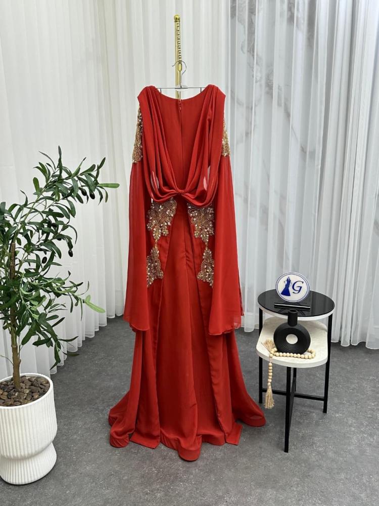 Ghada dress. Chiffon dress in warm taupe color reflecting calm elegance and natural attractiveness. It features lightweight and flowing fabric that gives you smooth movement and a delicate feminine look with every step.