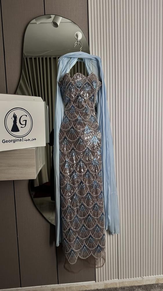 Friend. A luxurious beige champagne evening dress, fully embroidered with shiny details, a soft feminine cut that highlights the figure, with an elegant side slit.