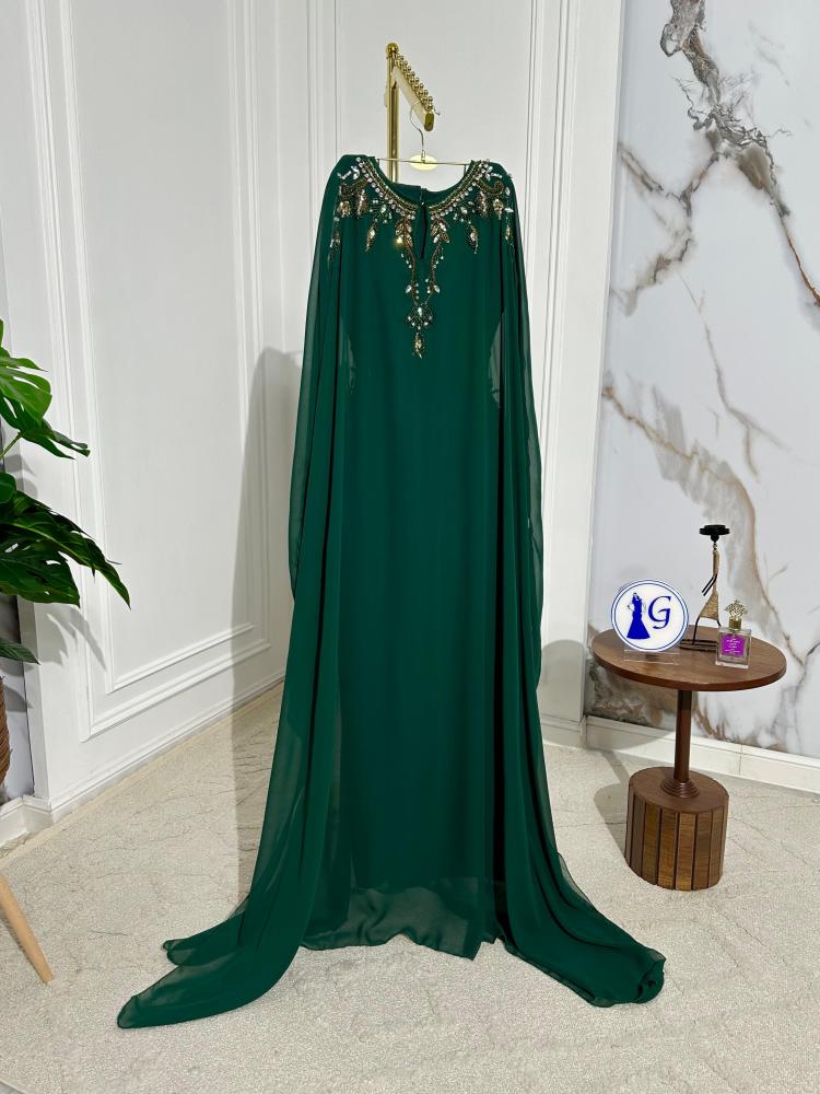 Sarah dress. Elegant green chiffon abaya that pulses with femininity and softness, characterized by lightweight and flowing fabric that gives you a comfortable and attractive look, perfect for occasions and a touch of daily luxury.