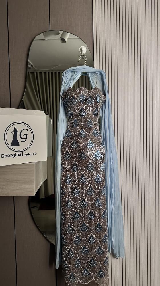 Friend. A luxurious beige champagne evening dress, fully embroidered with shiny details, a soft feminine cut that highlights the figure, with an elegant side slit.