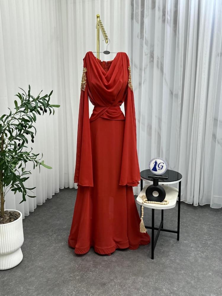 Ghada dress. Chiffon dress in warm taupe color reflecting calm elegance and natural attractiveness. It features lightweight and flowing fabric that gives you smooth movement and a delicate feminine look with every step.