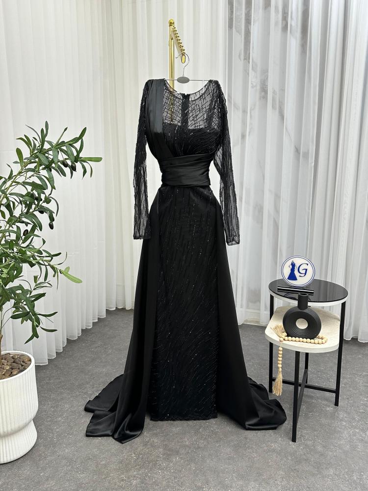 Dana. The material is soft silk on a piece of glittering fabric