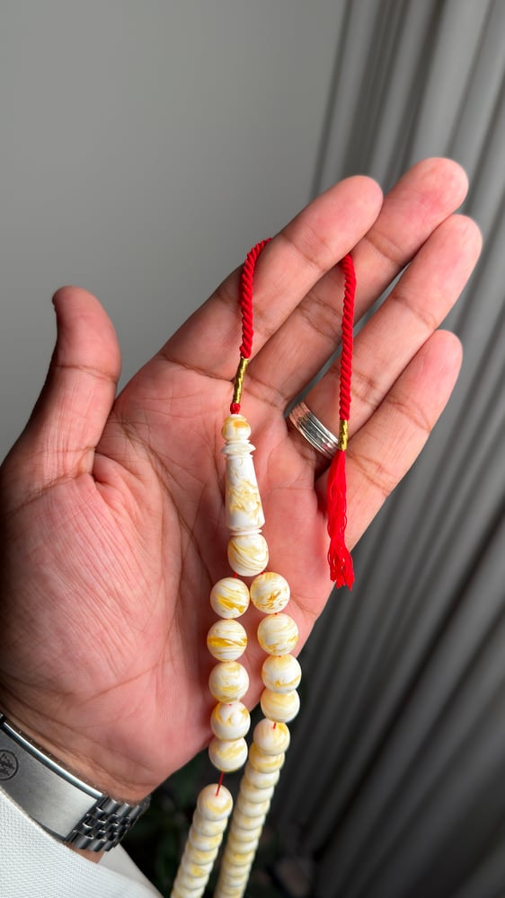 A black olivine prayer bead string