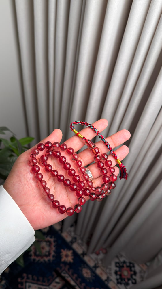Saffron-colored prayer beads